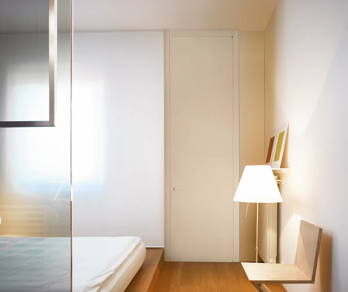 A bedroom with a full height internal door