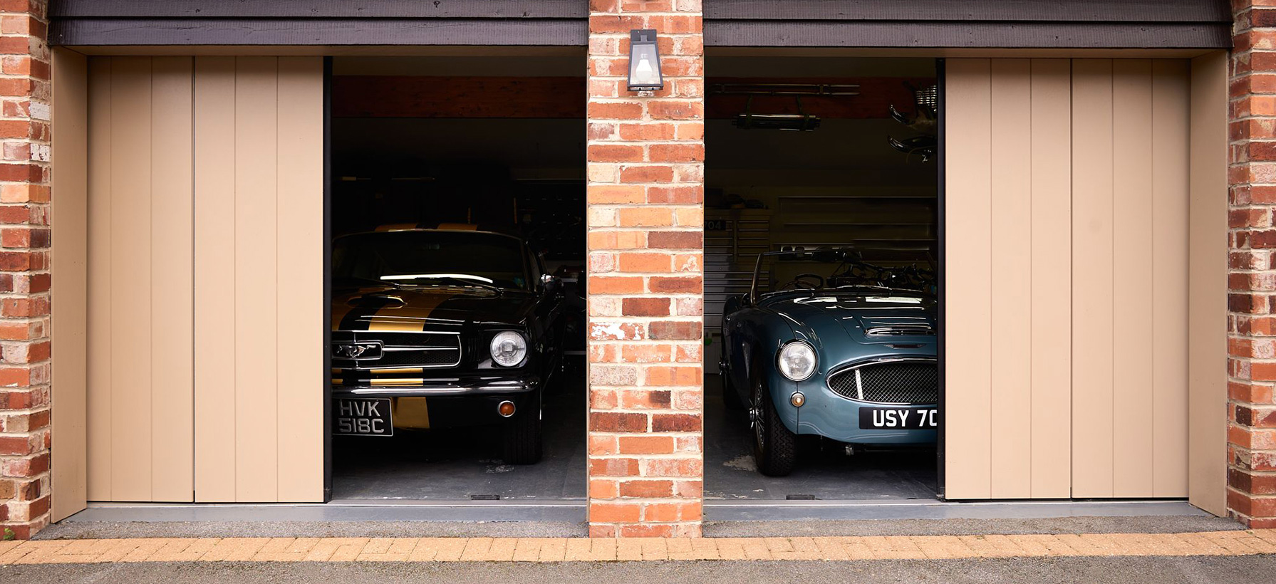 two premium bespoke garage doors half open