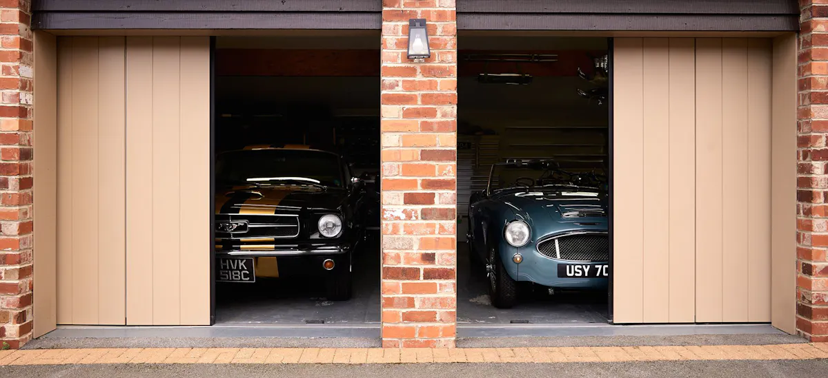 two premium bespoke garage doors half open