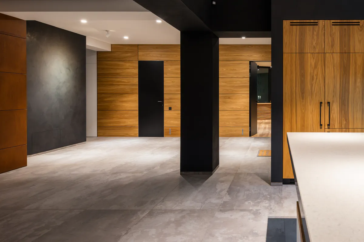 A modern cellar conversion - open plan space, ultra minimal with timber vennered fitted furniture.