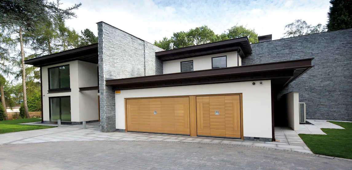 Modern house with wooden garage doors
