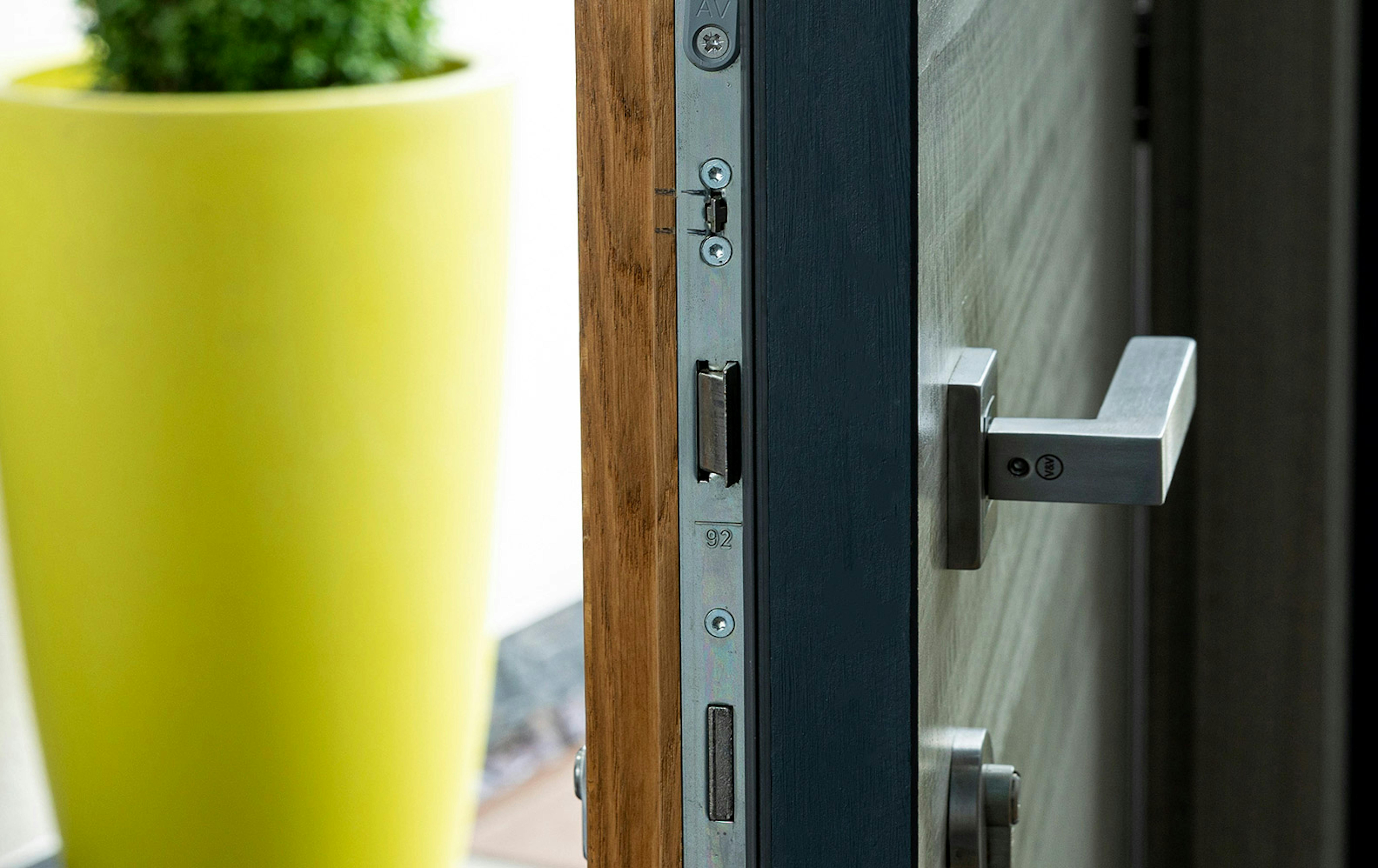 A close-up of the sophisticated locking system on a Deuren front door.