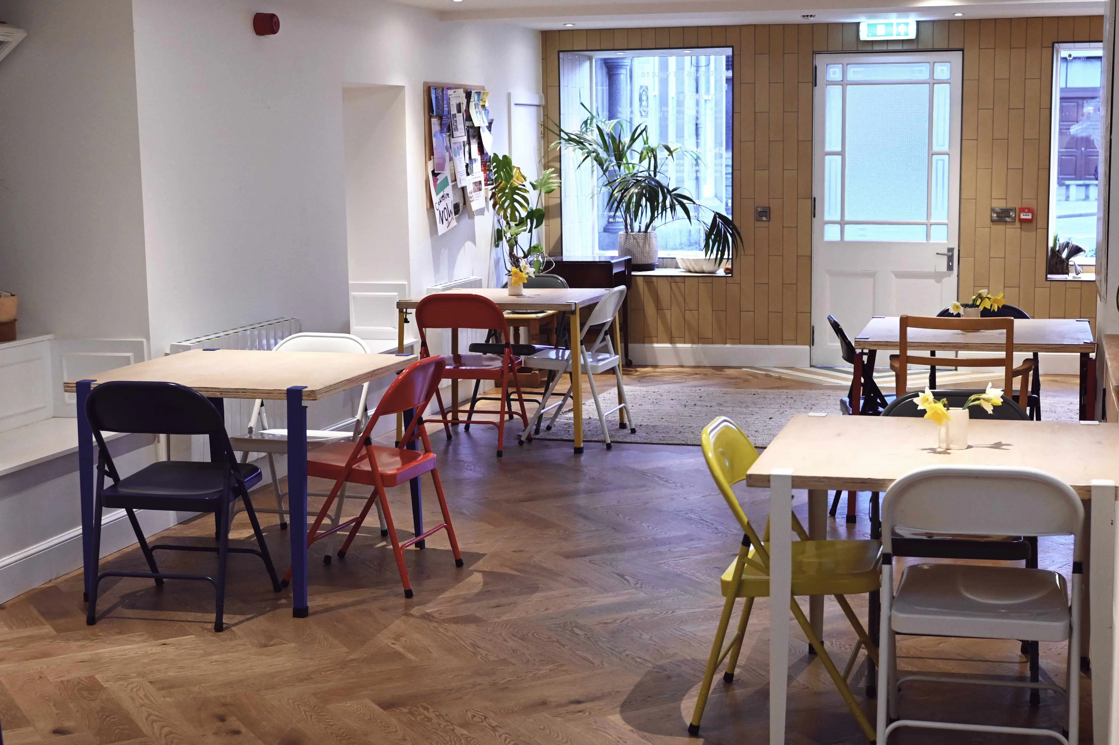 Café style table set up inside the community hub