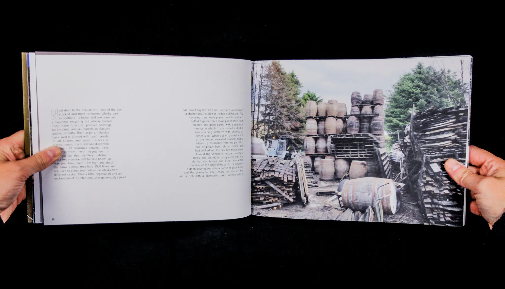 A double page spread: the left hand page features text shaped around a circle, and the right hand page features a photograph of whisky barrels piled on top of each other. 