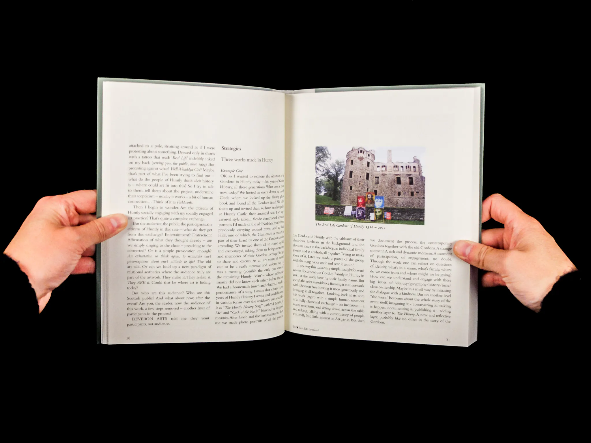 A double page spread featuring text, and an image of Huntly Castle behind several bright paintings