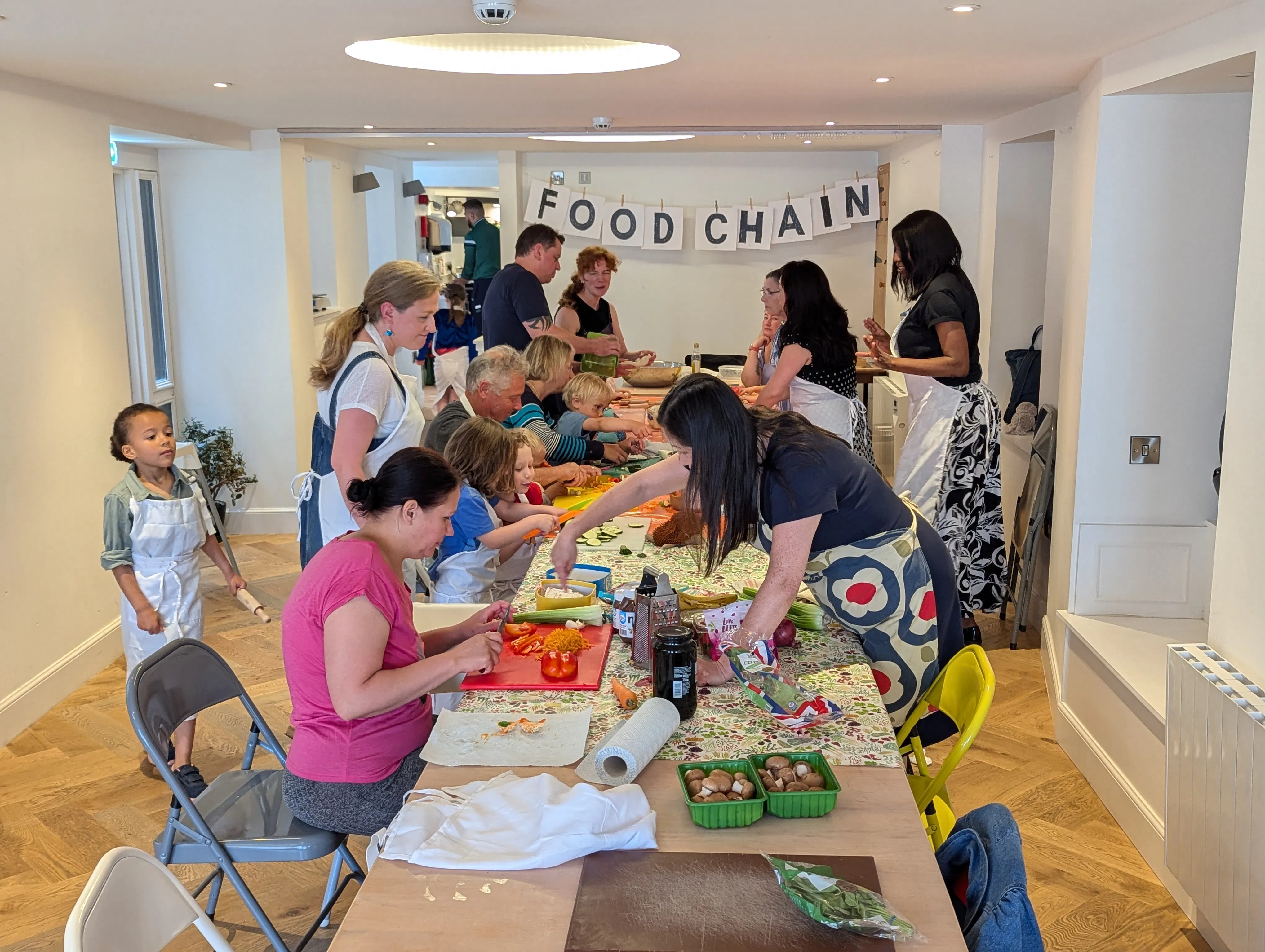 A photo of people cooking together.