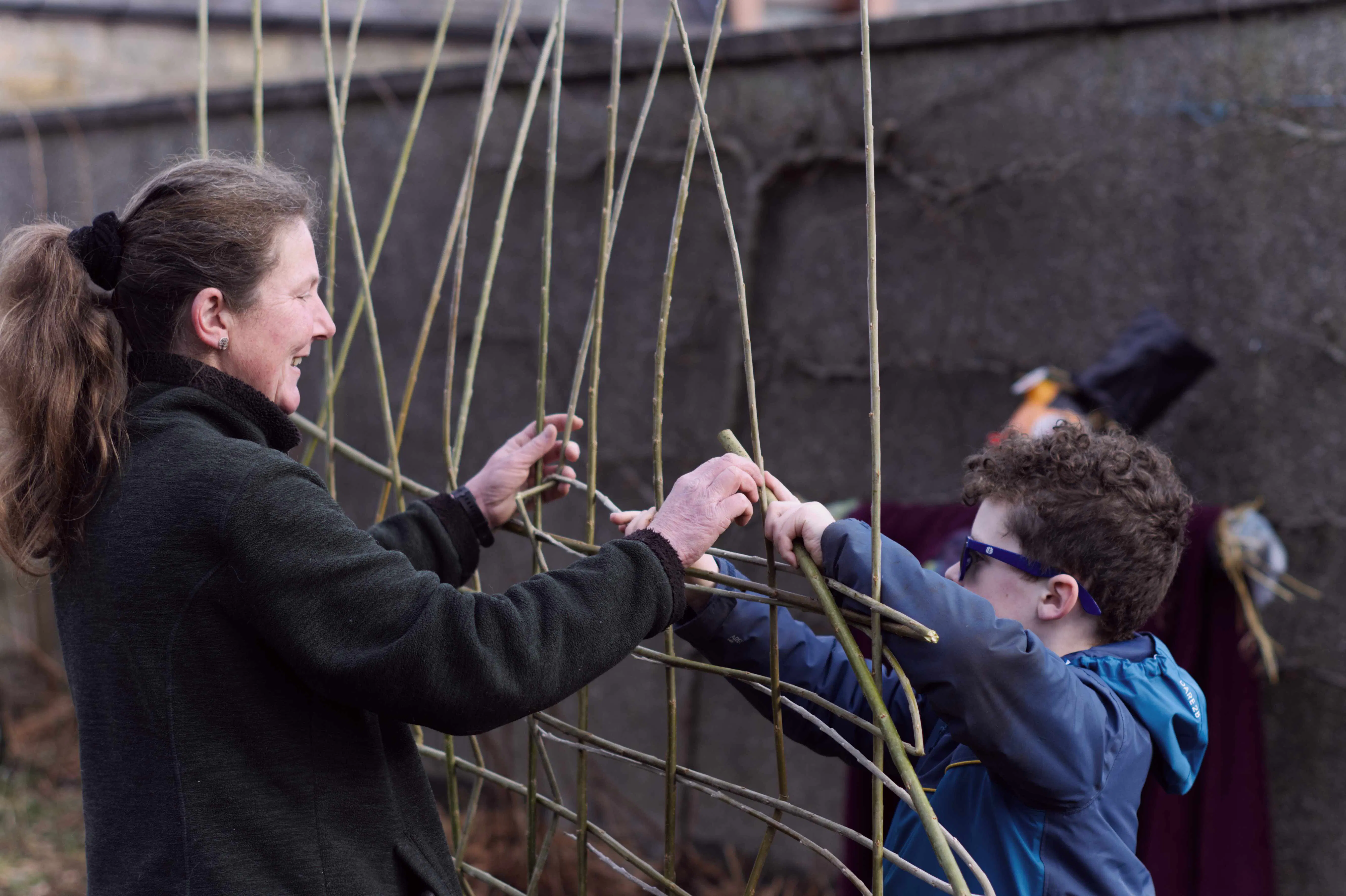 Building the garden shelter at the Winter Warmer (2024). Photo: Phoebe McBride
