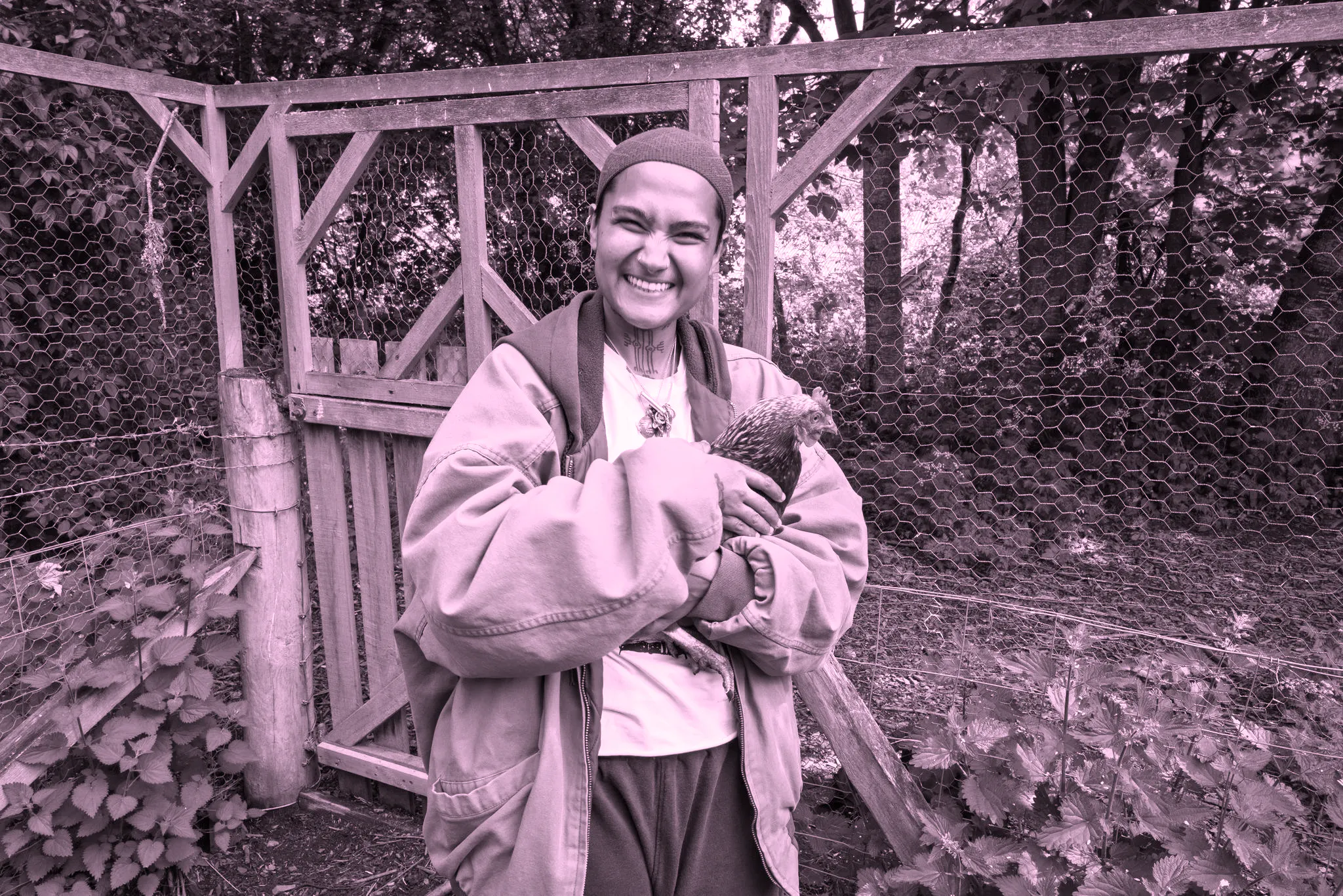 Rah Naqvi holding a chicken 
