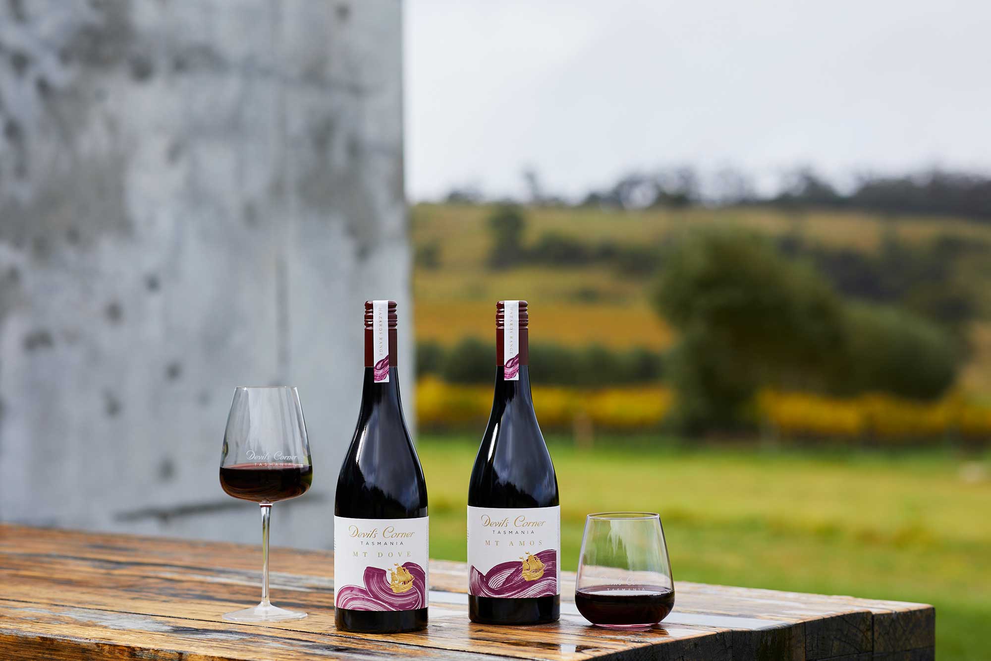 Two bottles and two glasses of the Devil's Corner Mt Dove and Mt Amos on a table
