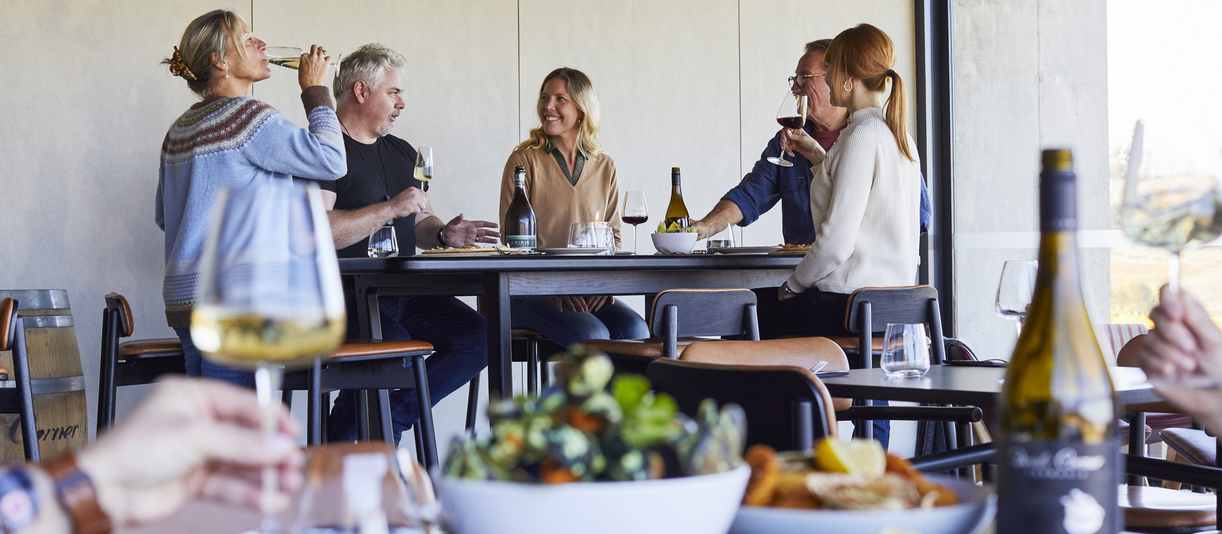 Group of friends enjoying food and wine