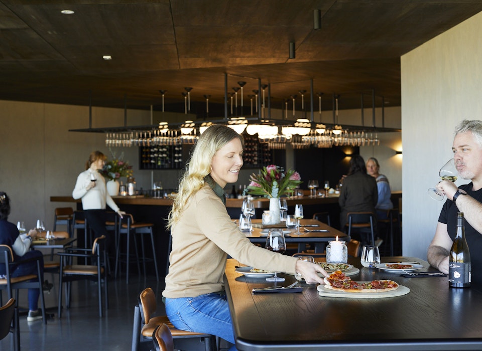 People enjoying food and wine in the Devil's Den