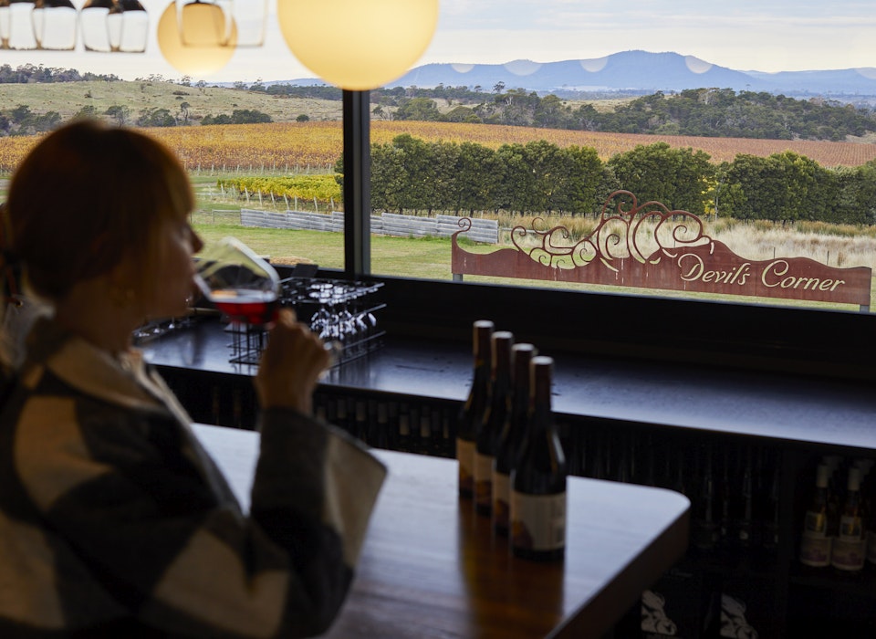 Woman drinking wine at the Tasting Bar in Cellar Door