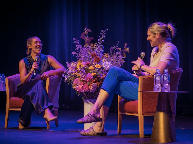 Lauren Jackson speaking at the panel at an International Women's Day event.
