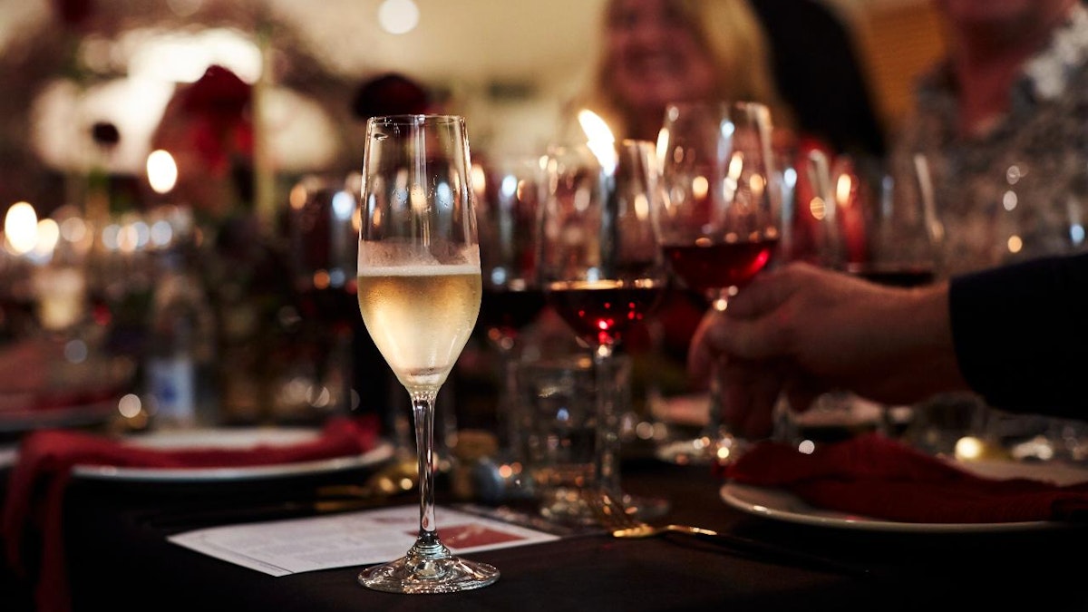 Event dinner setting with a glass of sparkling