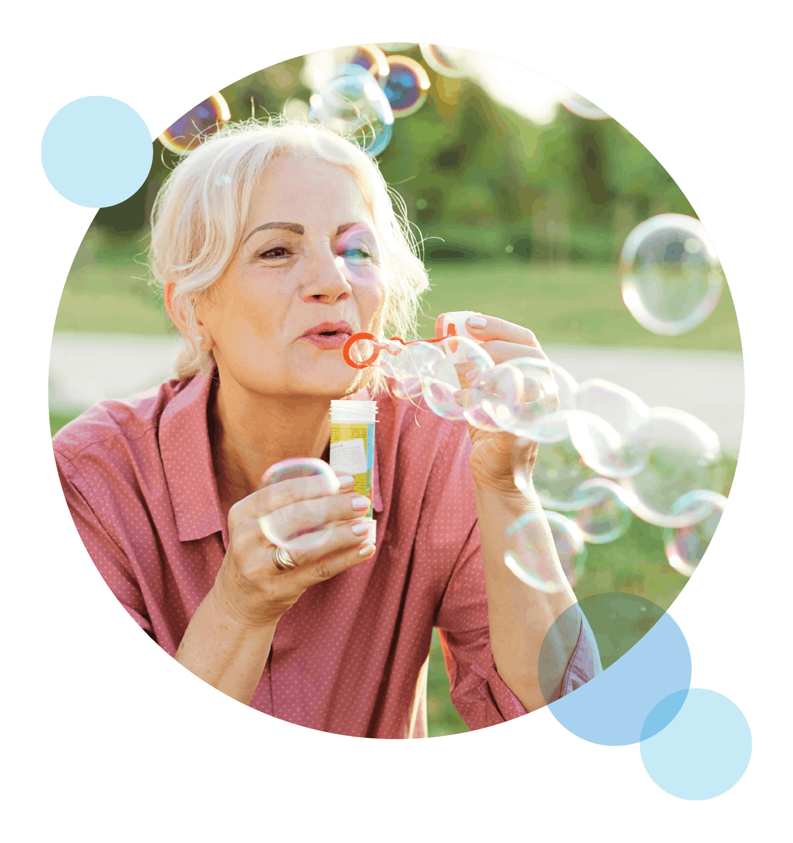 Happy Devoted Health member having fun blowing bubbles.