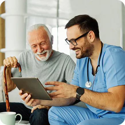 Healthcare provider consulting with a Medicare beneficiary in a clinical setting.