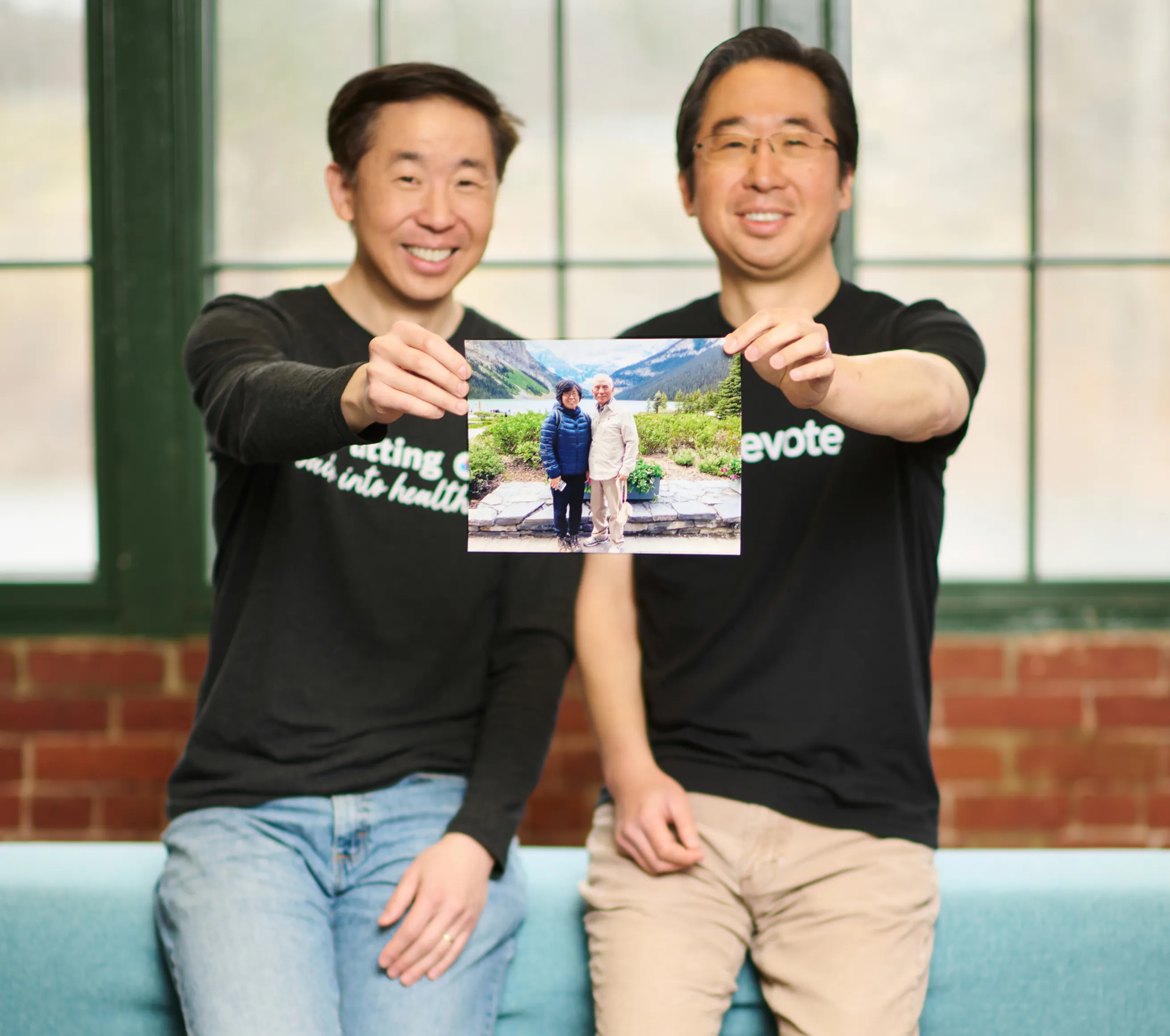Todd and Ed Park with a photo of their parents