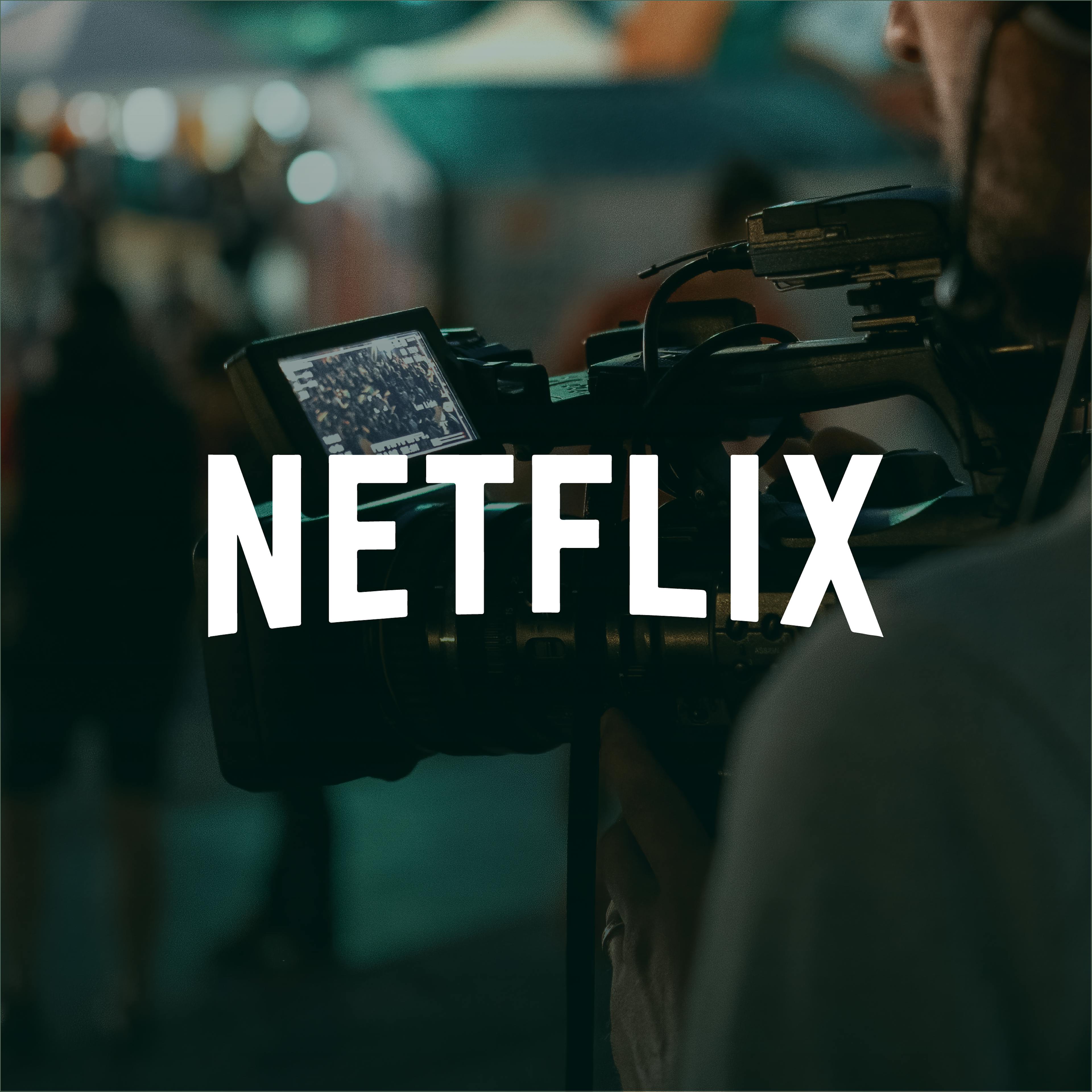 Cameraman filming with Netflix branding on the screen