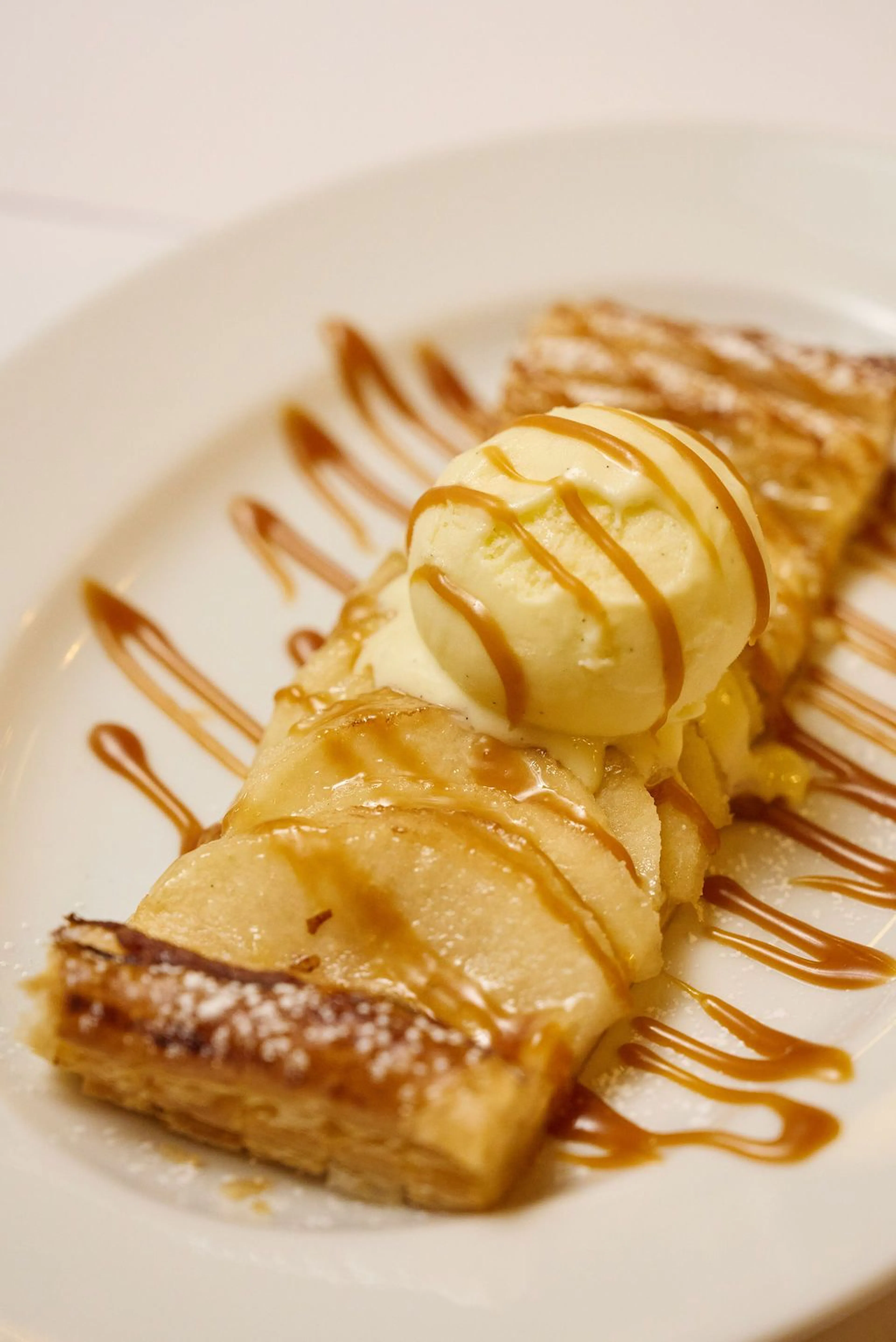 Tarte en bande at Le Gratin, featuring seasonal fruit layered over crisp puff pastry and served with ice cream.