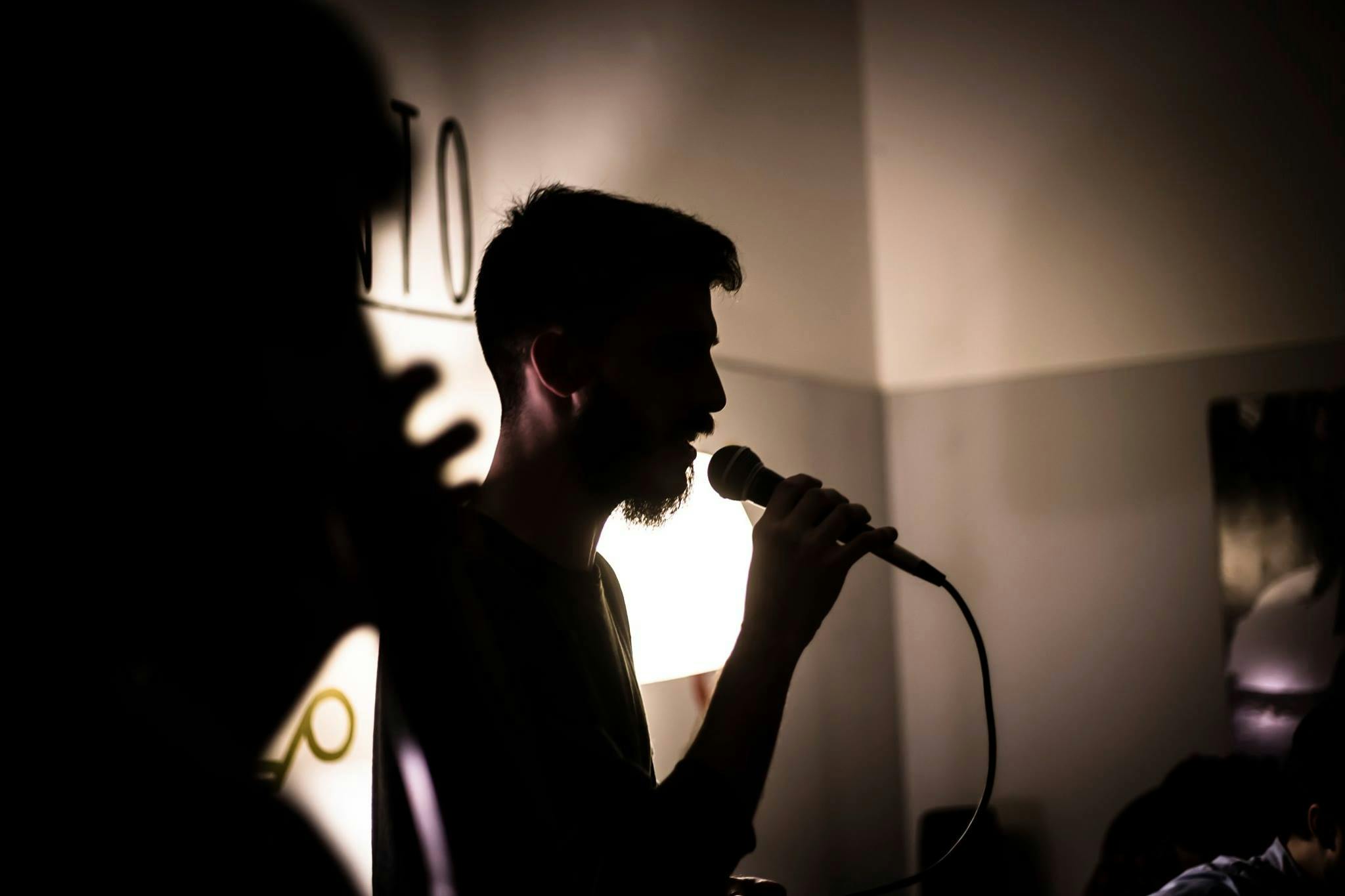 Man singing with a microphone.