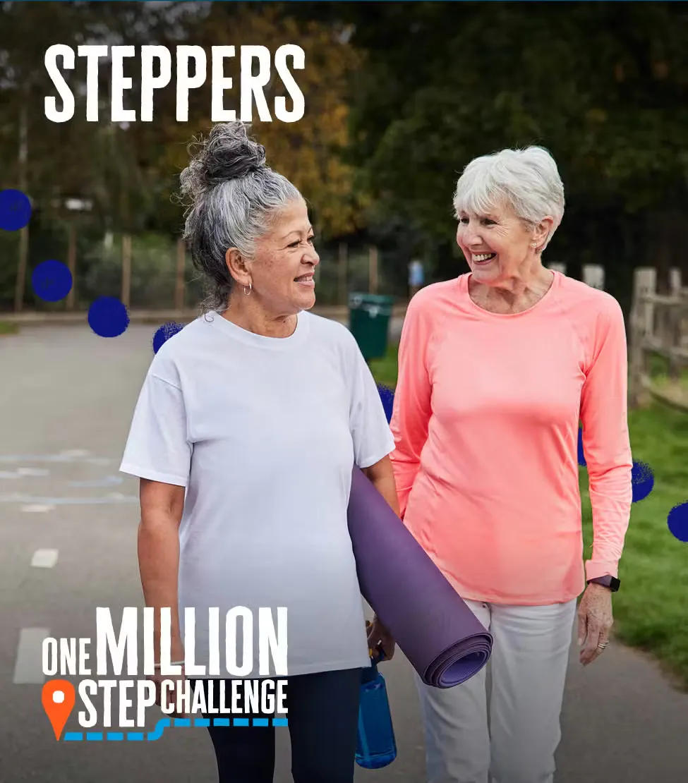 Two people walk outdoors together, one carrying a rolled yoga mat, both wearing activewear for the One Million Step Challenge.