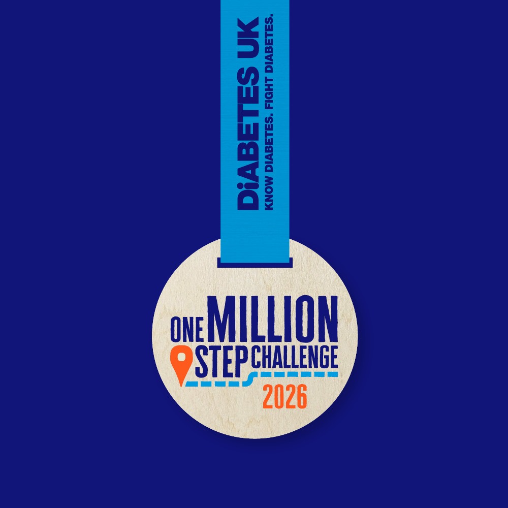 one million step challenge wooden medal with "2026" written on it, in front of a navy background 