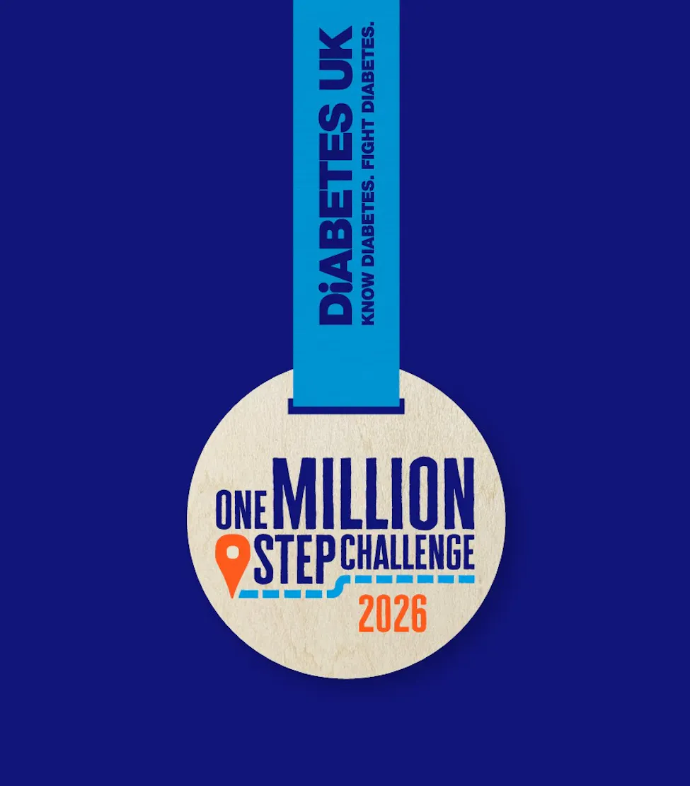 one million step challenge wooden medal with "2026" written on it, in front of a navy background