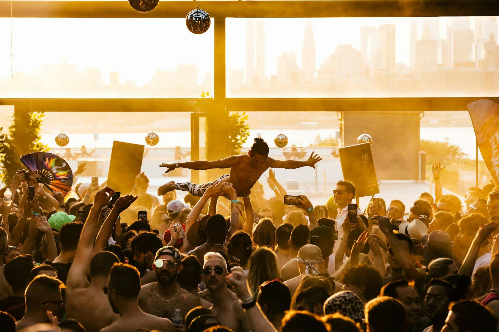 fan crowd surfing at The Roof at Superior Ingredients