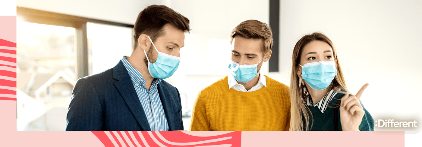 people wearing masks and inspecting a house