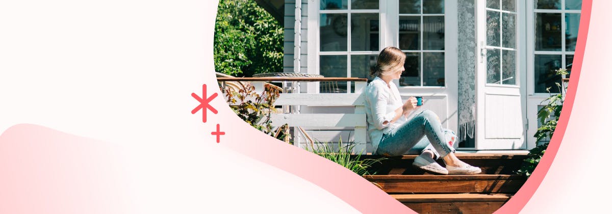 A woman sitting on her deck