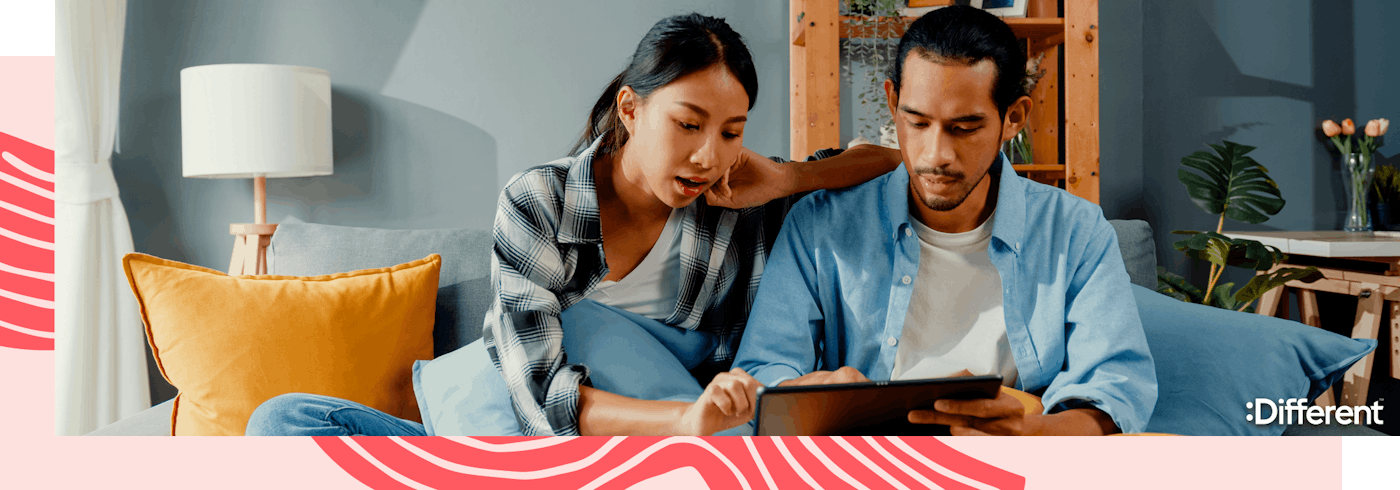 A young couple looking at the cost breakdown of selling a house