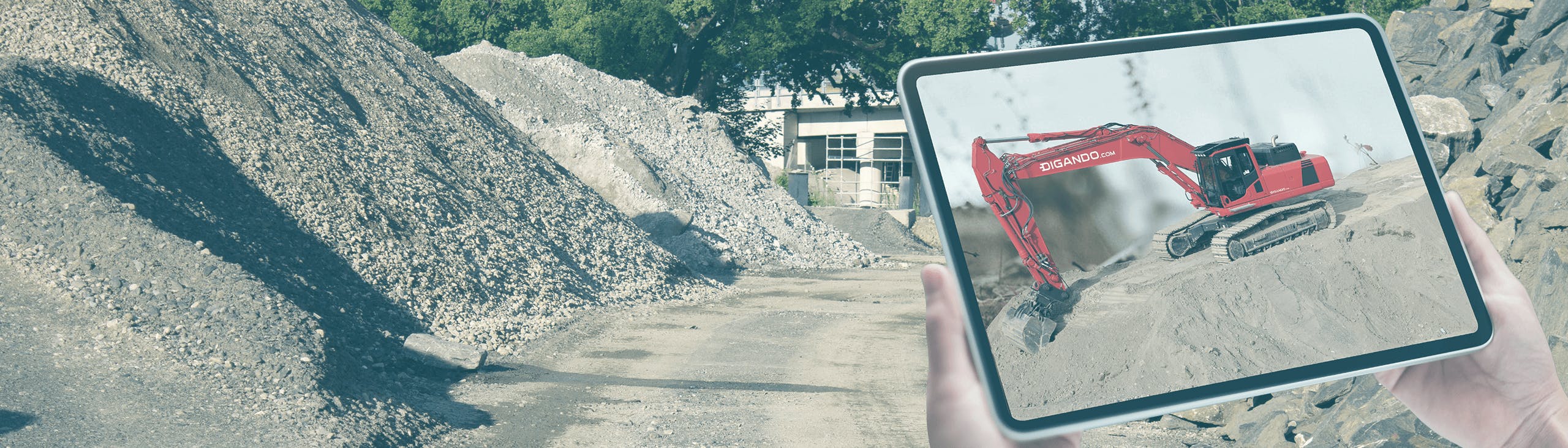 tablet mit bagger auf einer baustelle