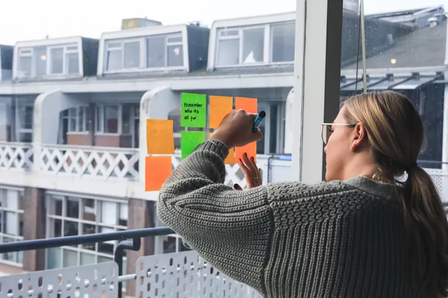 Woman writing on a window