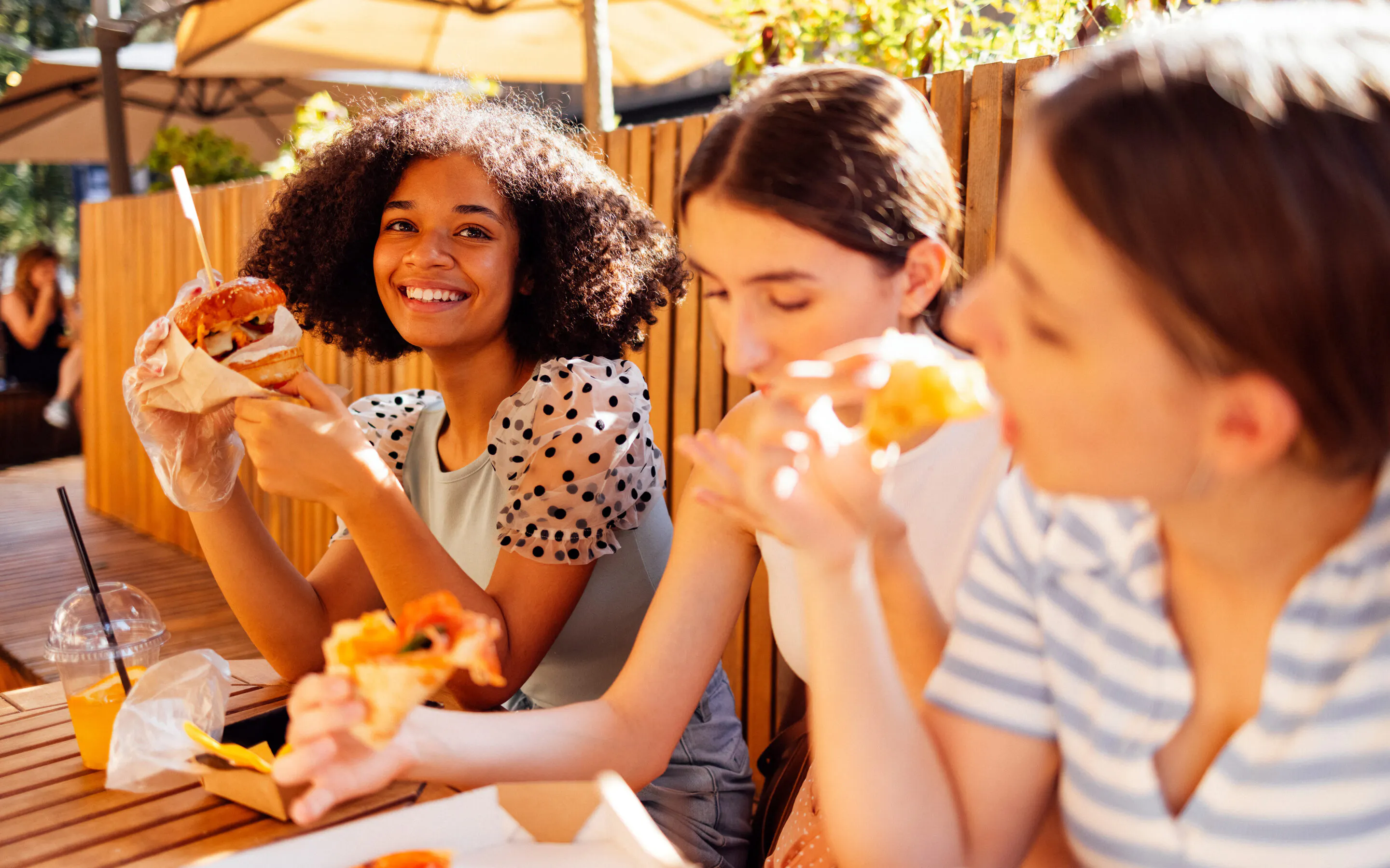 Group of women eating fast food