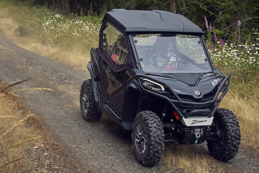 2025 CFMoto ZForce 800 Trail with a full cab and a passenger.