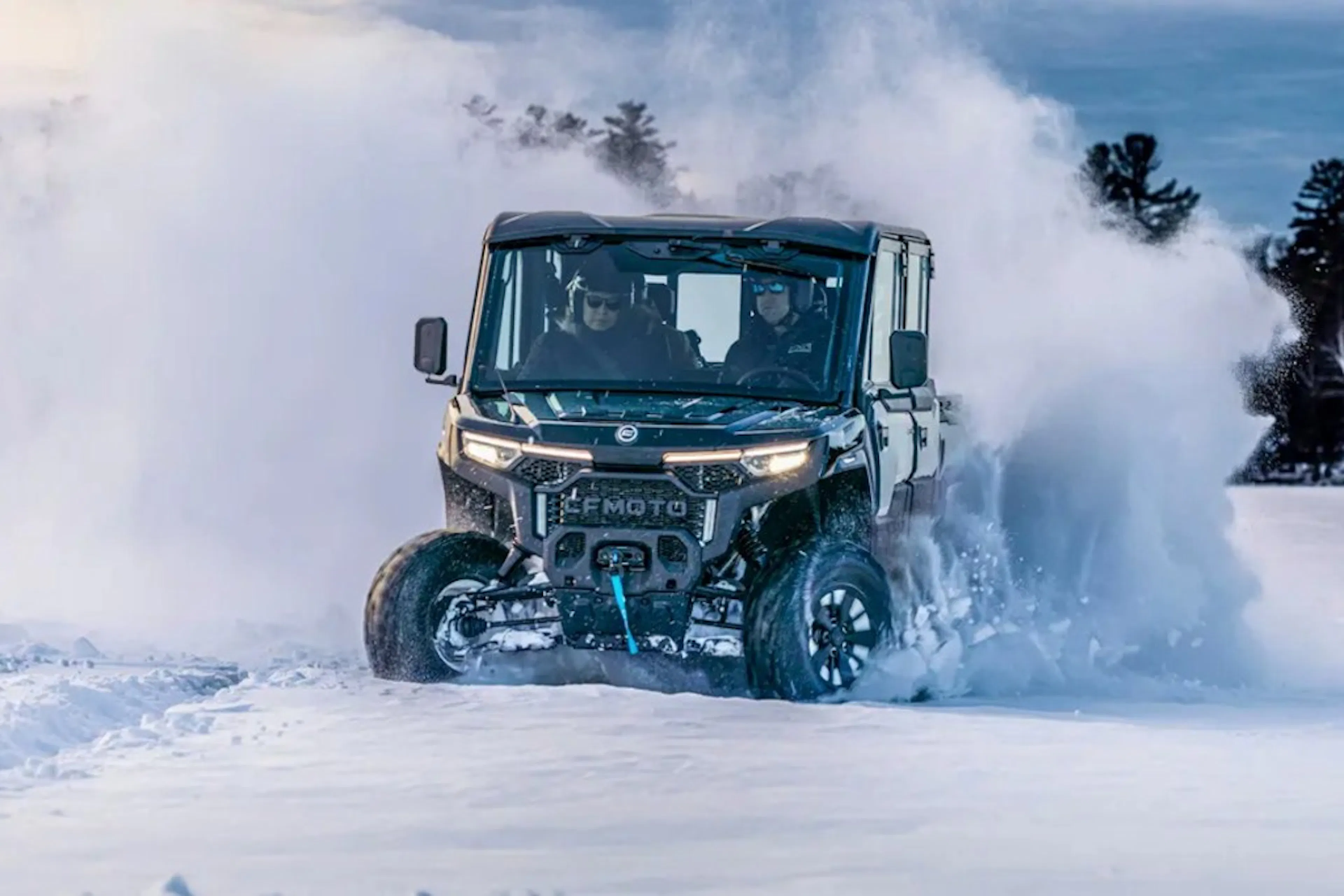 2025 CFMoto UForce U10 XL Pro Highland drifting through snow. 