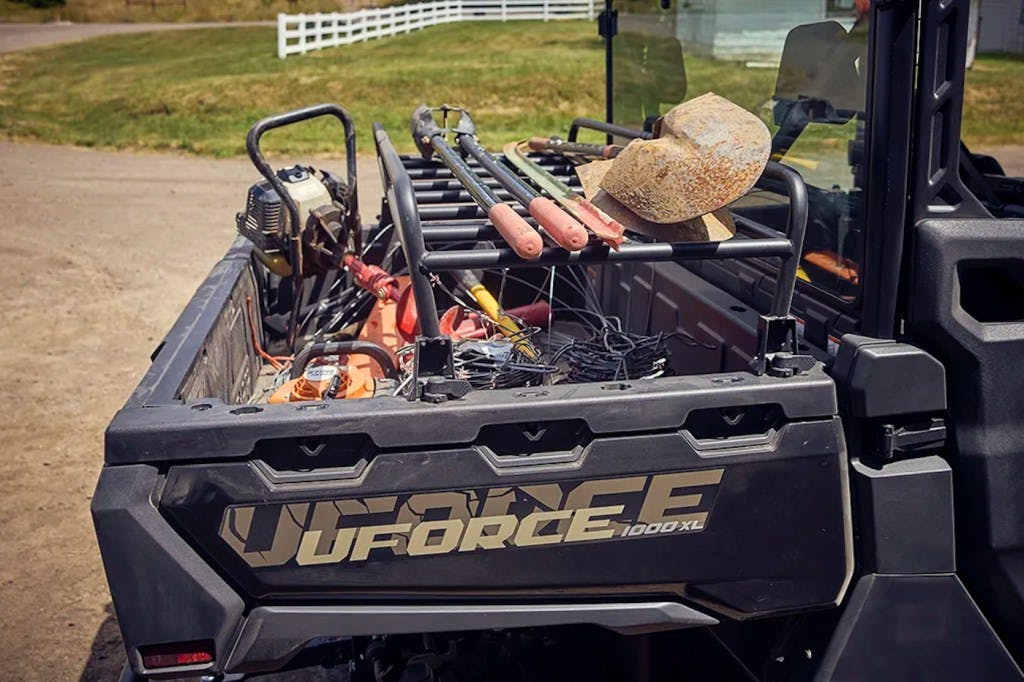 2025 CFMoto UForce 1000 XL bed loaded down with various landscaping tools.
