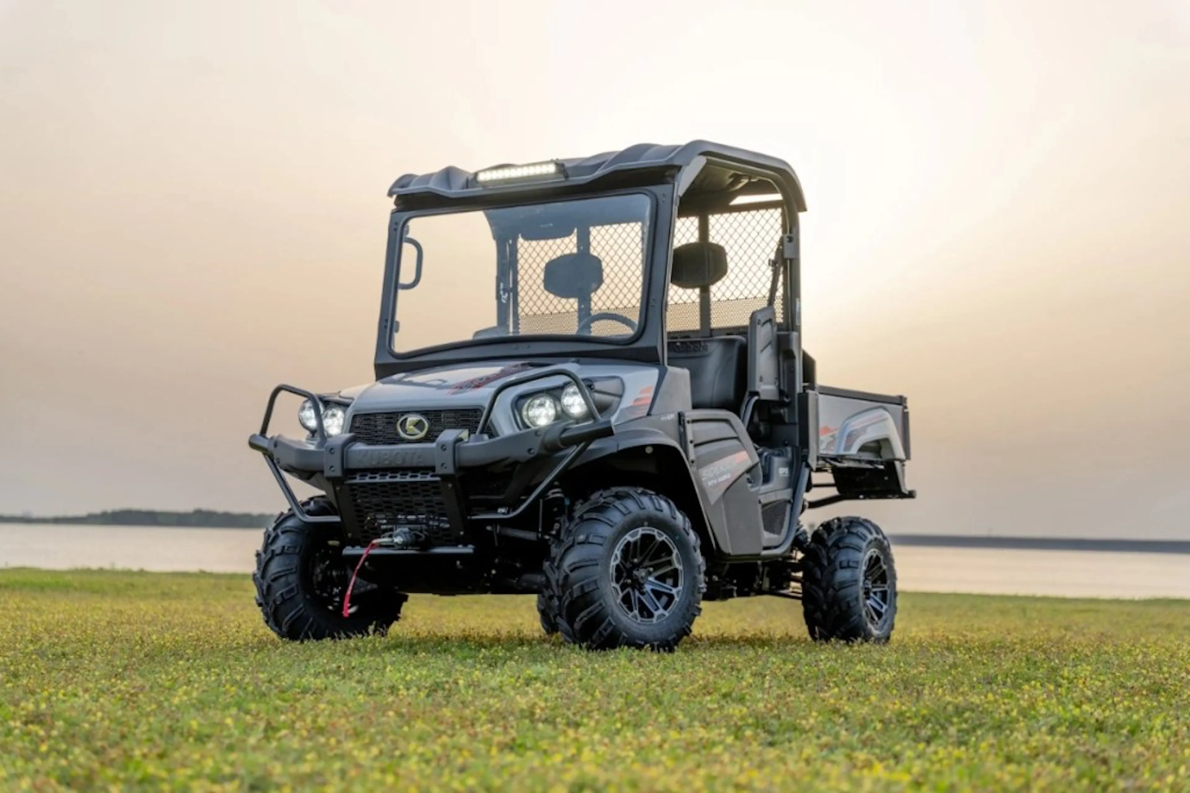 2025 Kubota Sidekick parked in the grass.