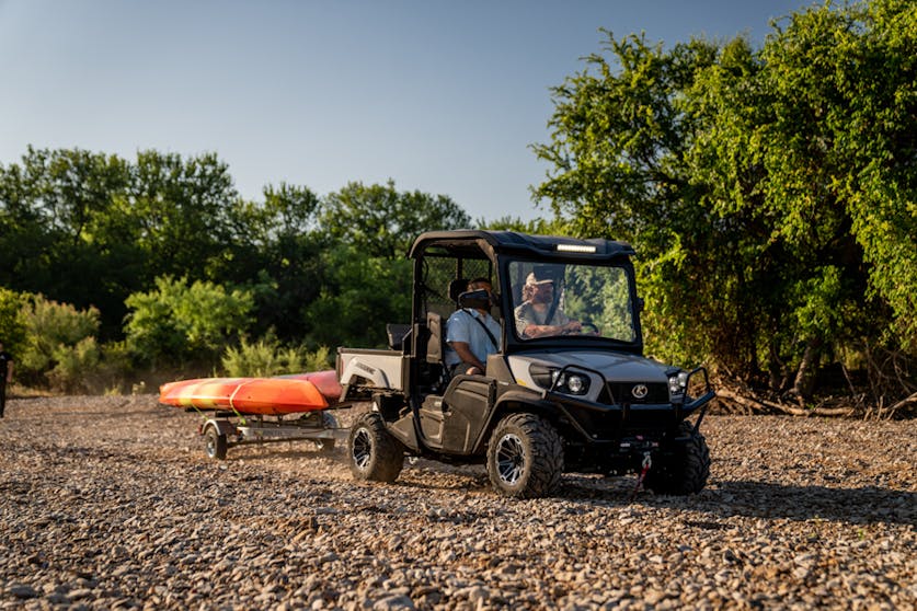 2025 Kubota Sidekick hauling a pair of kayaks.