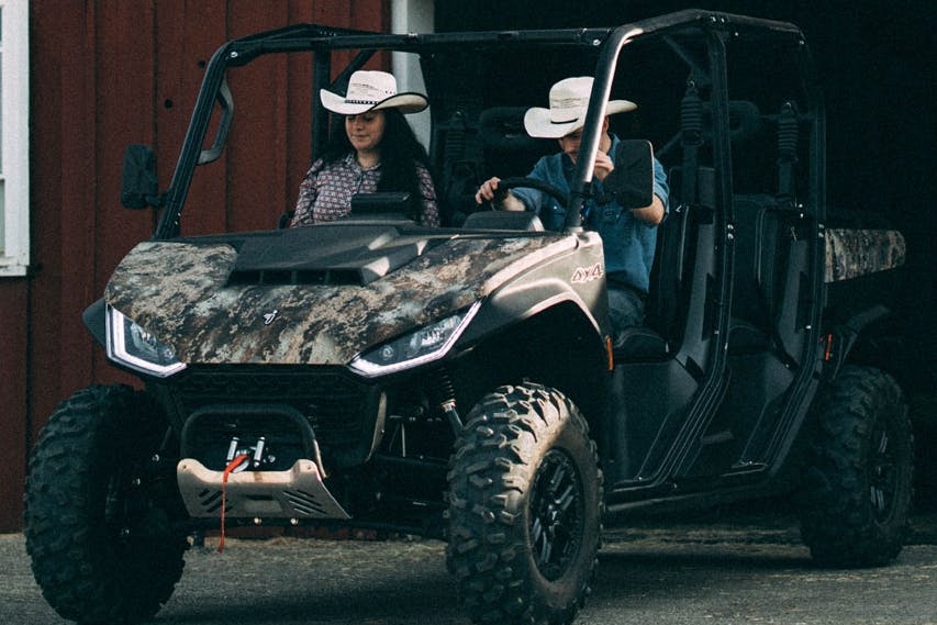 2025 segway ut10 crew with two buckaroos exiting a barn.
