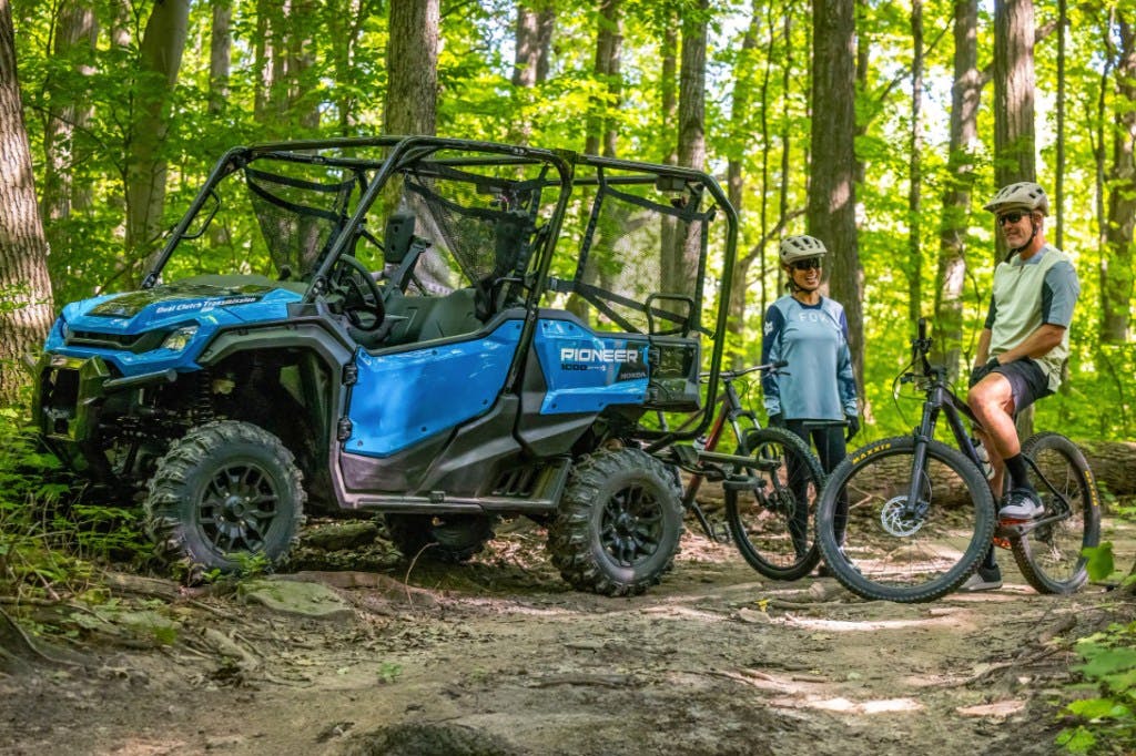 honda pioneer 1000-5 with mountain bikes.