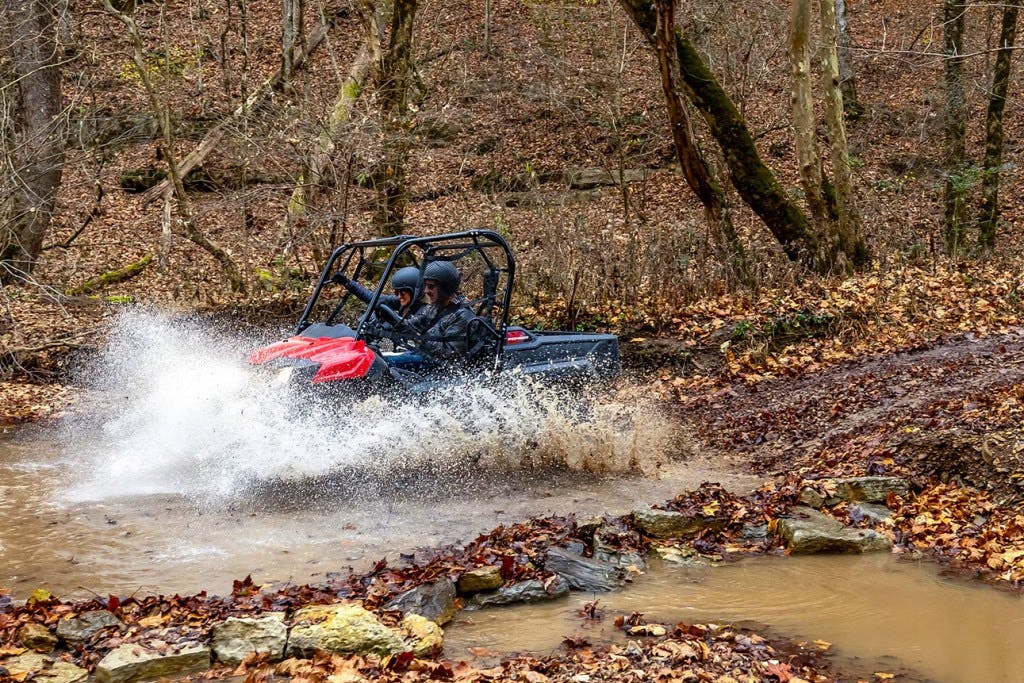 2025 Honda Pioneer 700 being pulled into the depths by an unseen leviathan.