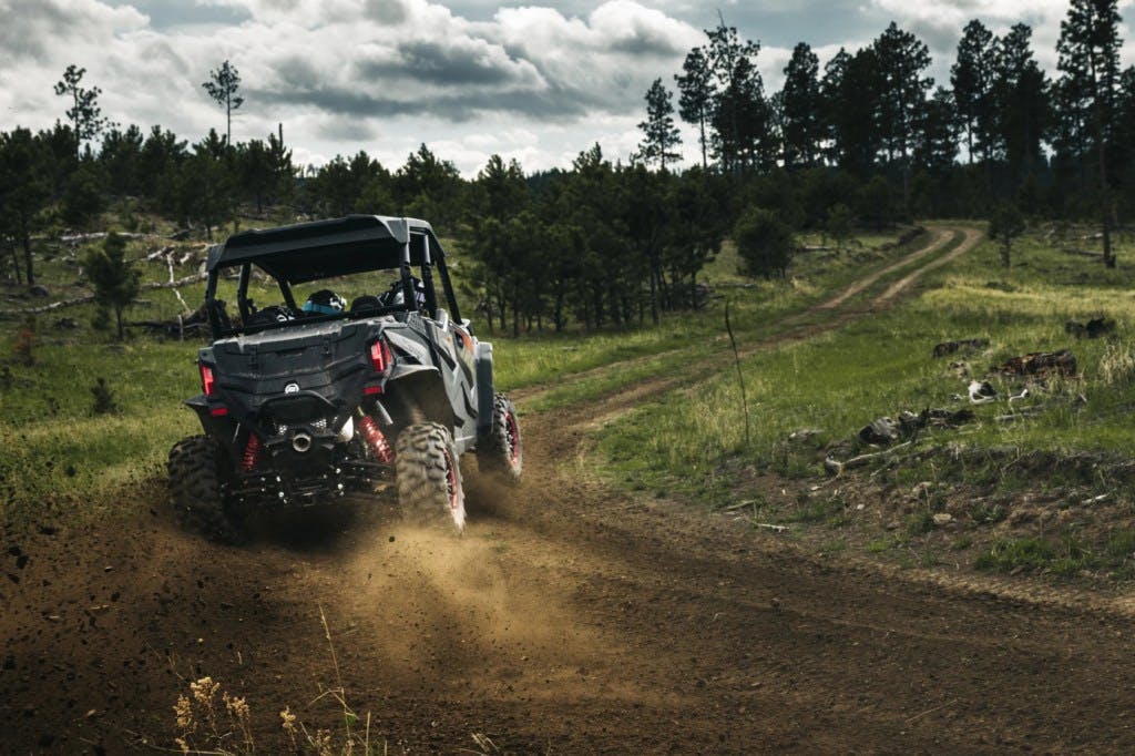 2025 CFMoto ZForce 950 Sport-4 sliding around a corner.