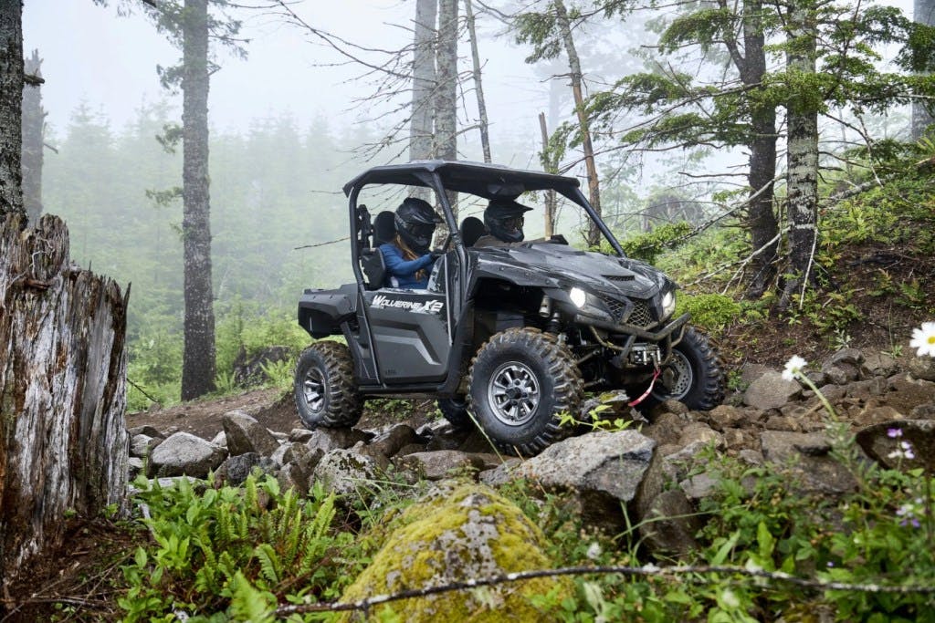 2025 yamaha wolverine x2 1000 riding over a rocky trail.