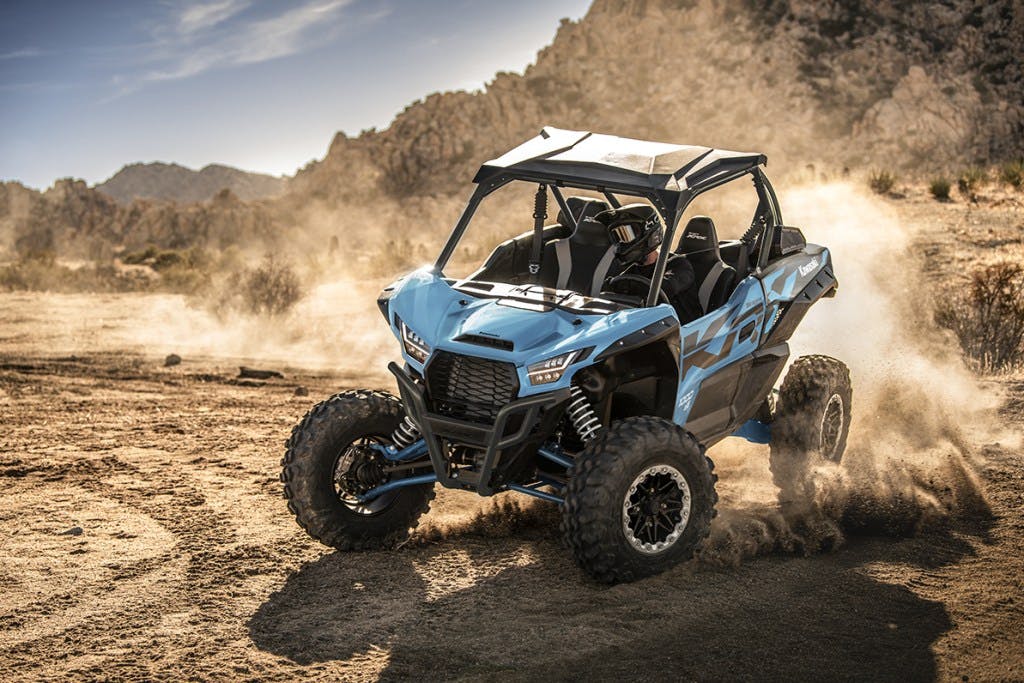 2025 kawasaki teryx krx 1000 es drifting around a corner.