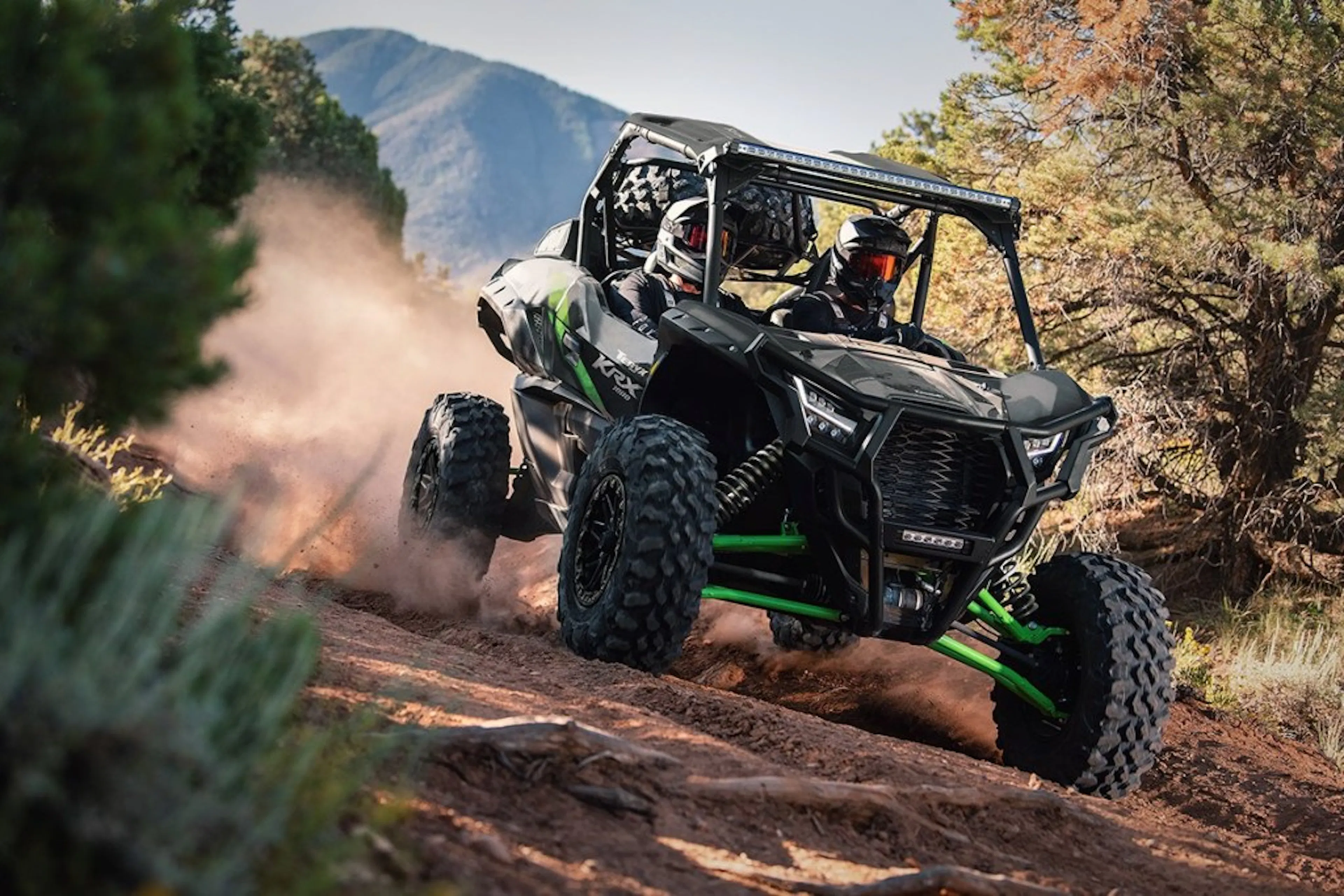 2025 kawasaki teryx krx 1000 riding on a dirt trail. 