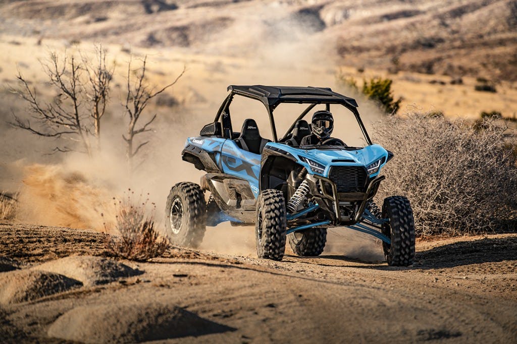 2025 kawasaki teryx krx 1000 es riding on a desert trail.