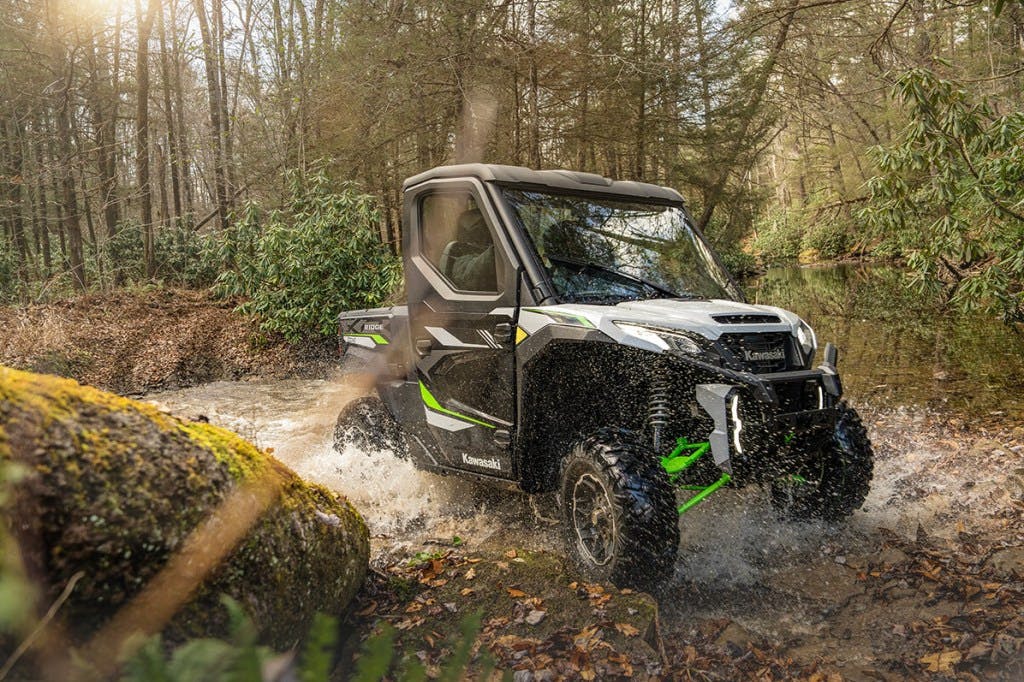 2025 Kawasaki Ridge XR crossing a stream.