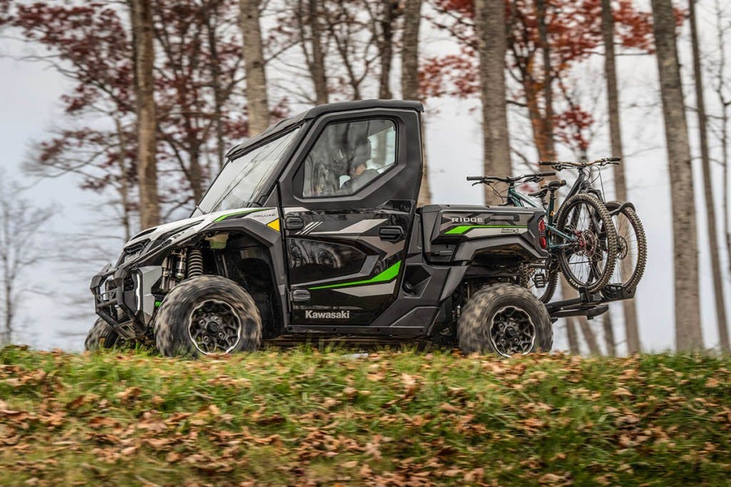 2025 Kawasaki Ridge XR Deluxe with a bicycle carrier attachment.