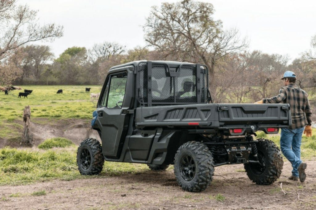 2025 can-am defender pro  sitting outside a pasture
